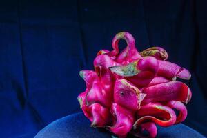 close up view of dragon fruit on black background photo