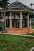 close-up view of permanent gazebo building in city park. photo