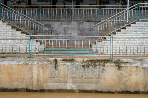 looking far from the garden steps with the river's brick fence. photo