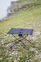 Top view compact camping table, frame table for picnic in nature photo