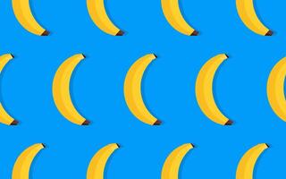 Seamless pattern with yellow bananas on a blue background vector