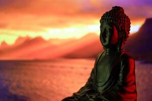 Buddha Purnima and Vesak day concept, Buddha statue with low key light against beautiful and colorful background. Meditation photo