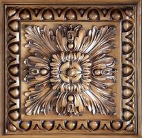 Elegant dark brown ceiling with stone patterns and a rosette texture photo