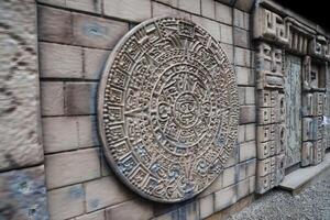 Ancient Mayan Calendar or Aztec calendar with rough relief surface photo