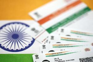 Indian Aadhaar card from Unique Identification Authority of India on Indian flag photo