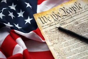 Preamble to the Constitution of the United States and American Flag close up photo