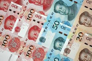 Many money bills of People Republic of China. PRC Yuan banknotes photo