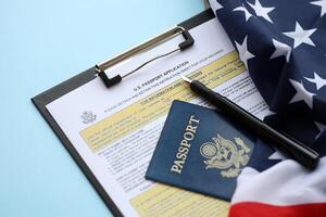 Department of State form DS11 Application for a U.S. Passport lies on table and ready to fill photo