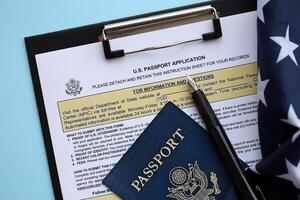 Department of State form DS11 Application for a U.S. Passport lies on table and ready to fill photo