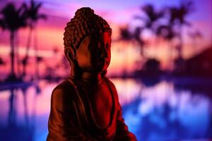 Buddha Purnima and Vesak day concept, Buddha statue with low key light against beautiful and colorful background. Meditation photo