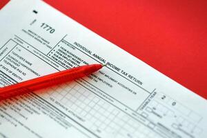 Indonesian tax form 1770 Individual Income Tax Return and pen on table photo