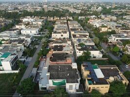 View at city from bird sight. City from drone. Aerial photo. City scape from drone on 2023-07-22 in Lahore Pakistan photo