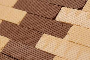 Stacked delicious chocolate wafers in large amount. Two different flavours of classic waffles photo