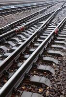 Photo fragment of the railroad tracks in the rainy weather