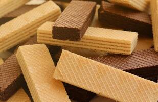 Stacked delicious chocolate wafers in large amount. Two different flavours of classic waffles photo