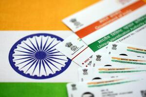 Indian Aadhaar card from Unique Identification Authority of India on Indian flag photo