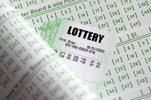 Green lottery tickets and blank bills with numbers for playing lottery photo