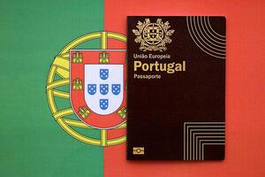 Red Portugal passport of European Union on national flag background close up photo