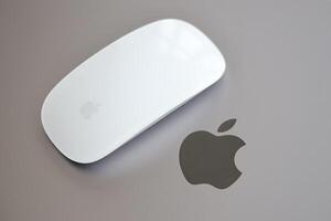 KYIV, UKRAINE - NOVEMBER 27, 2023 Apple Magic Mouse 3rd generation lies with grey MacBook 2021 photo