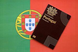 Red Portugal passport of European Union on national flag background close up photo