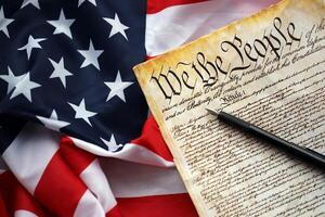 Preamble to the Constitution of the United States and American Flag close up photo