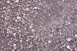 Background of shattered stony stones surface in mountain area. Texture with natural light photo