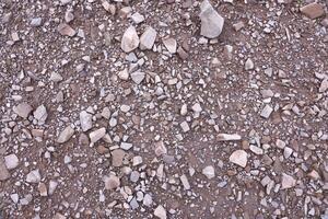 Background of shattered stony stones surface in mountain area. Texture with natural light photo