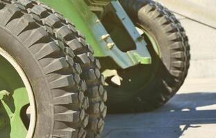 A close-up wheels of a portable weapon of the Soviet Union of World War II, painted in a dark green photo