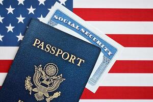 New Blue United States of America Passport and Social Security number on US Flag background photo