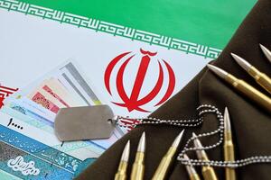 Many bullets and iranian rials money bills on flag of Islamic Republic of Iran photo