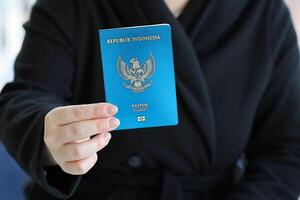 Indonesia passport and service workers table on process of citizenship registration photo