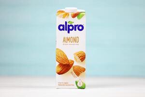 KHARKIV, UKRAINE - JANUARY 2, 2021 Alpro almond vegetarian milk pack produced by European company based in Wevelgem photo