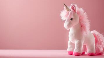 Unicorn toy in pink fluffy plush form is a stuffed animal fantasy perfect for childhood play photo