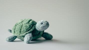 Plush green turtle toy with soft texture and cute design on white background photo