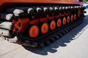 Rubber tracks of the all-terrain vehicle, off-road vehicle, rubber linings, tracked vehicles, a vehicle for swamps, military equipment. photo