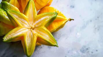 Ripe starfruit with tropical carambola on a fresh juicy background of green and yellow hues photo