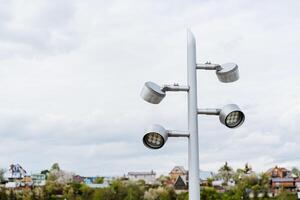 Street lamppost, modern lighting of the city park, street lamp, LED lamp euro standard, design of urban lighting. photo