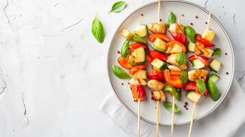 Colorful Stir-fry Chicken and Vegetables on Skewers with Fresh Basil on a Plate photo