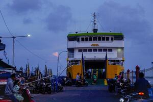 Jepara Central Java, April 7, 2024 - rear view of an inter-island crossing ship against the background of the evening sky with free space for photocopying. front view of the ship docked at the Jepara photo