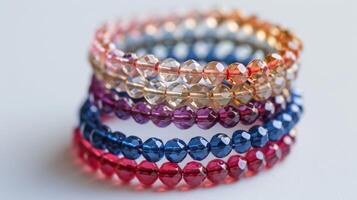 Stack of colorful glass bead rings presents fashion, jewelry, accessories, and a rainbow of handmade beauty photo