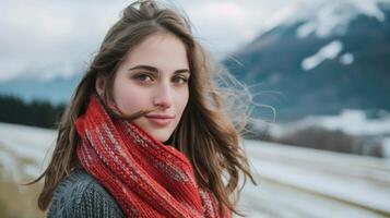 Serene brunette woman with scarf in Austrian winter mountains landscape photo