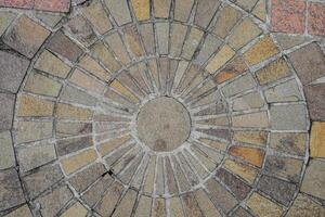 top view of the floor with natural stone neatly arranged with circular dots at the posts photo