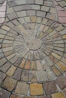 top view of the floor with natural stone neatly arranged with circular dots at the posts photo