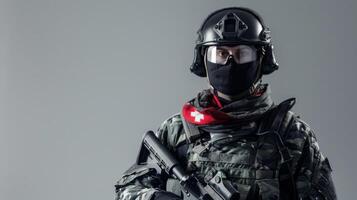 Swiss mercenary in full combat gear with helmet, tactical vest and assault rifle photo