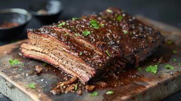 Succulent beef brisket barbecue with spices and parsley on wood board photo