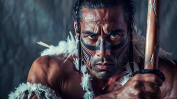 Maori warrior with indigenous tattoo displaying tribal tradition and culture from New Zealand in a powerful portrait photo