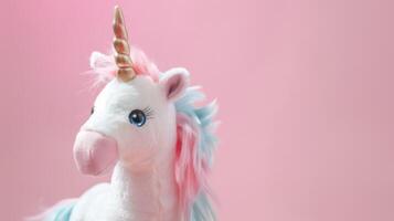 Cute plush unicorn toy in pink and white with a fluffy fantasy aesthetic photo