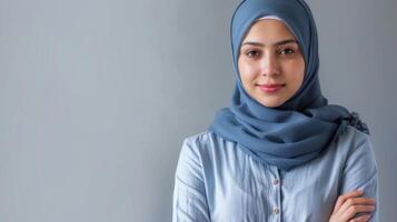 Education professional in hijab portrays Muslim teacher with a confident smile showing diversity and empowerment photo