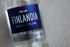 KYIV, UKRAINE - FEBRUARY 27, 2024 Bottle of famous Finlandia vodka alcohol drink on table photo