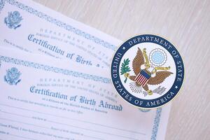 KYIV, UKRAINE - MARCH 9, 2024 US Department of State seal on Certification of Birth Abroad photo